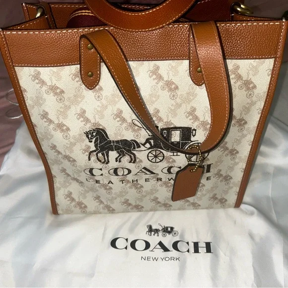 Coach Brown and Cream Tote Bag that is the sun that is casting spots on the bag - Picture 2 of 7